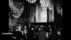1947: NEW YORK NIGHT LIFE: NIGHT: People entering Monte Carlo Night Club doorman. INT MS Couples slow dancing band. VS Elderly couple (SOT implies editor &amp; manufacturer) talking laughing at dining table. Dinner night life dance club NYC Instructional Video