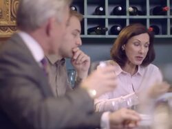 MS PAN Businessman holding digital tablet and giving presentation in restaurant Stock Footage