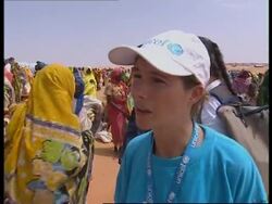 Refugees in camps; militiamen surrender; interview News Clip