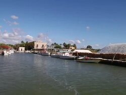 Mozia (Motya), sailnig in the canal to island of Mozia, on the sides there are piles of salt Stock Footage