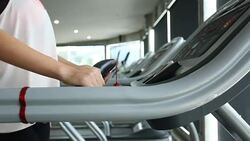 sport women running on treadmill cardio equipment Stock Footage