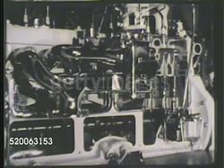 1935: ENGINE PRODUCTION: INT VS Propeller engine parts on display, showing moving gears, crankshafts, piston rods, & other engine parts, partial propeller turning slowly. Modern industry, industrial plant, mechanics Instructional Video