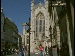 Bath Abbey, Avon - MS tourists by old Gothic style stone building Stock Footage
