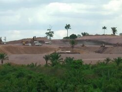 WS T/L View of trucks working at huge construction at amazon / Belo Monte, Para, Brazil  Stock Footage