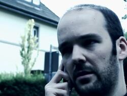 Mafia gangster on the phone, urban setting, slow motion Stock Footage