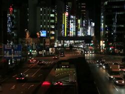 MS View of illumination city at night and moving traffic on road / Ginza, Tokyo, Japan Stock Footage
