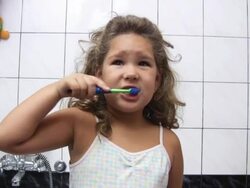 Girl brushing teeth (HD) Stock Footage