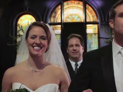 Couple kisses at alter: PULL to guests clapping Stock Footage