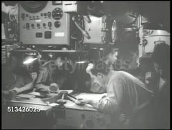 1940s: UNITED STATES NAVY: EXT WS Deck of U.S. Navy submarine moving at sea. INT VS Navy submariner in control room, looking over map. EXT WS (POV back of submarine) Submarine moving through waters, leaving wake. WWII, World War II, Pacific Front Instructional Video