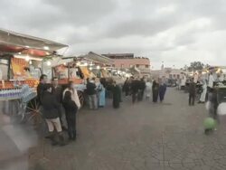 CU PAN T/L View of fruits and food shop on  Djemaa el-Fna square street / Marrakech, Morocco Stock Footage