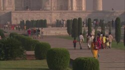 Tourists carry refreshments as they walk toward the Taj Mahal. Stock Footage