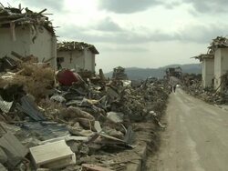 Destruction in Rikuzentakata, Iwate Prefecture, Japan on 2nd April 2011; after tsunami following Tohuku earthquake of March 2011.  This coastal town suffered severe damage with a large part of the residential area being completely flattened. Stock Footage