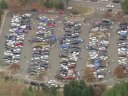 WS AERIAL View of Car parking area with people on Wallace Wade Stadium / North Carolina, United States Stock Footage