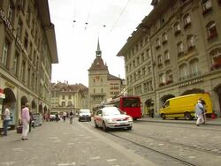 MS Bus stop and church far of street / Bern, Switzerland Stock Footage
