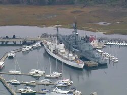 MS AERIAL Shot of USS Yorktown Museum at boats marina / South Carolina, United States Stock Footage