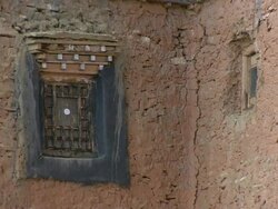 CU View of window and wall detail of Tsakang gompa tibetan buddhist monastery / High Himalayas, Upper Dolpo near Tibetan border, Nepal Stock Footage