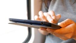 Woman use social media for communication in the sky train Stock Footage
