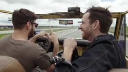 Friends cruising in classic Bronco talk and laugh Stock Footage