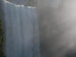 Closeup of Vernal Fall, sun shining through morning mist, on the Merced River in Yosemite National Park, California Stock Footage