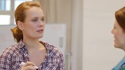 Businesswoman communicating with female colleague Stock Footage