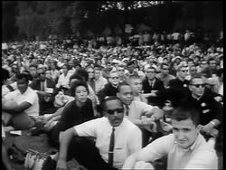 B/W August 28, 1963 crowd sitting on lawn watching Marian Anderson sing on steps of Lincoln Memorial Stock Footage