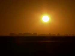 Shot of sunrise as truck passes by. Stock Footage