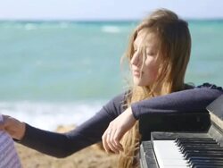 girl with notes on the coast Stock Footage