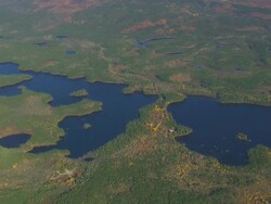 WS AERIAL PAN ZI TD View of wooded area with autumn color and lakes / Maine, United States Stock Footage
