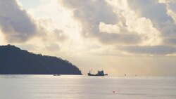 Fishing trawler sails into open sea Stock Footage