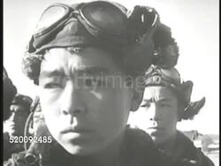 1945: JAPANESE PILOTS: Young adult males in pilot uniforms lined up in rows. CU Young male pilot. HA WS Imperial Officer speaking to group (no SOT). Kamikaze, or Uhka, Shimpu (Divine Wind). WWII, World War II. Instructional Video