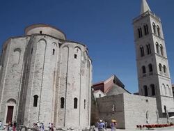 Zadar, Church of Saint Donatus, Pre-Romanesque, and the Campanile bell tower of the Saint Anastasia cathedral Stock Footage