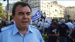 Uniformed officers march against austerity measures News Clip