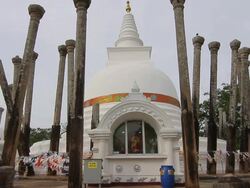 MS Thuparama Dagoba, first dagaba built in Sri Lanka after introduction of Buddhism, contains collarbone of Buddha / Anuradhapura, North Central Province, Sri Lanka Stock Footage