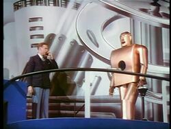 1940 man talking to robot next to him thru telephone / New York World's Fair / industrial Stock Footage