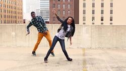 MS Couple dancing together on rooftop Stock Footage