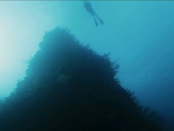 Silhouette of scuba diver swimming at the surface of the sea Stock Footage