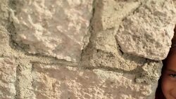 Cute young hispanic girl smiles at camera on third-world street corner Stock Footage