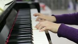 boy playing the piano Stock Footage
