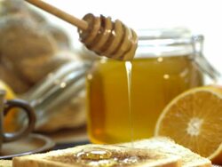 Honey dripping on a toast Stock Footage