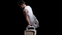 SLO MO Gymnast performing double leg circle on pommel horse Stock Footage