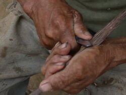 Senior man preparing an arrow, village of Mapajo inhabited by the tribe of Mosetenes, Bolivia, Amazon Stock Footage
