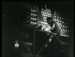 Theatre electrician brings on a spotlight, London, UK, 1950 Stock Footage
