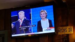 Debate viewers in Indiana react while watching on TV as Donald Trump and Hillary Clinton debate for the second time in St. Louis Stock Footage