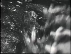 Heavy machinery digs through a coal tunnel in the 1930's. News Clip