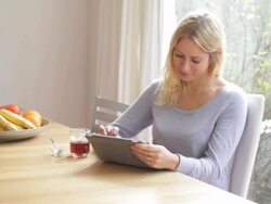 Young female working on digtial tablet Stock Footage