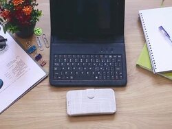 Office supplies and gadgets on wooden table Stock Footage