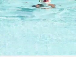 Swimmer in a Frog Costume Stock Footage