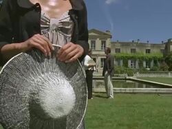 CU, TU, Woman standing in front of palace, man and woman talking in background, Saint Ferme, Gironde, France Stock Footage