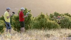 LD Two UAV pilots landing a drone successfully Stock Footage