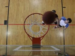 MS  Two young men playing basketball against each-other inside  gymnasium / Minneapolis, Minnesota, United States  Stock Footage